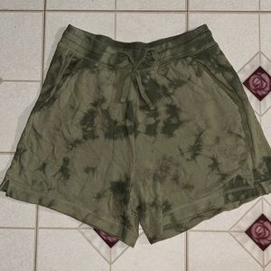 Green tie-dye shorts. Breathable. Adjustable strings. Multiple pockets.